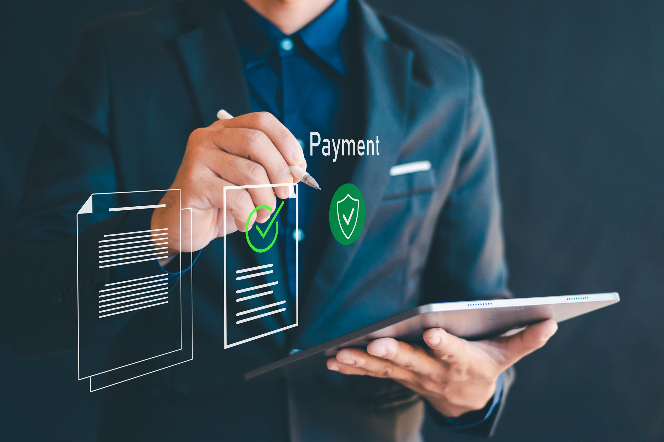 Business professional using a tablet to manage secure digital payments, representing unattended payment integration for ISVs.